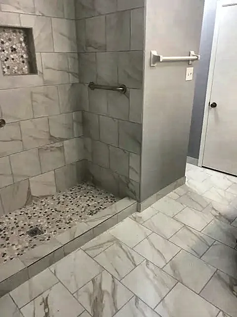 Walk-in tile shower with grab bars by Brown Sterling Builders