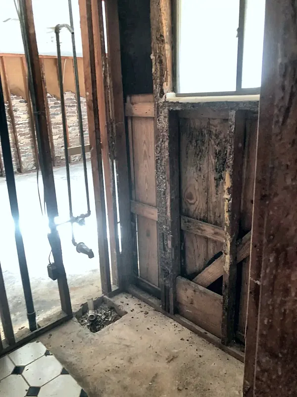 Bathroom stripped after flooding by Brown Sterling Builders