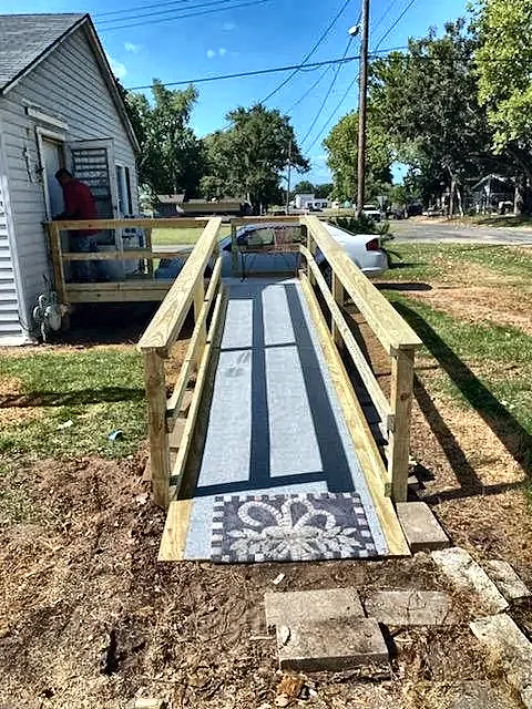 Wheelchair ramp with handrails by Brown Sterling Builders